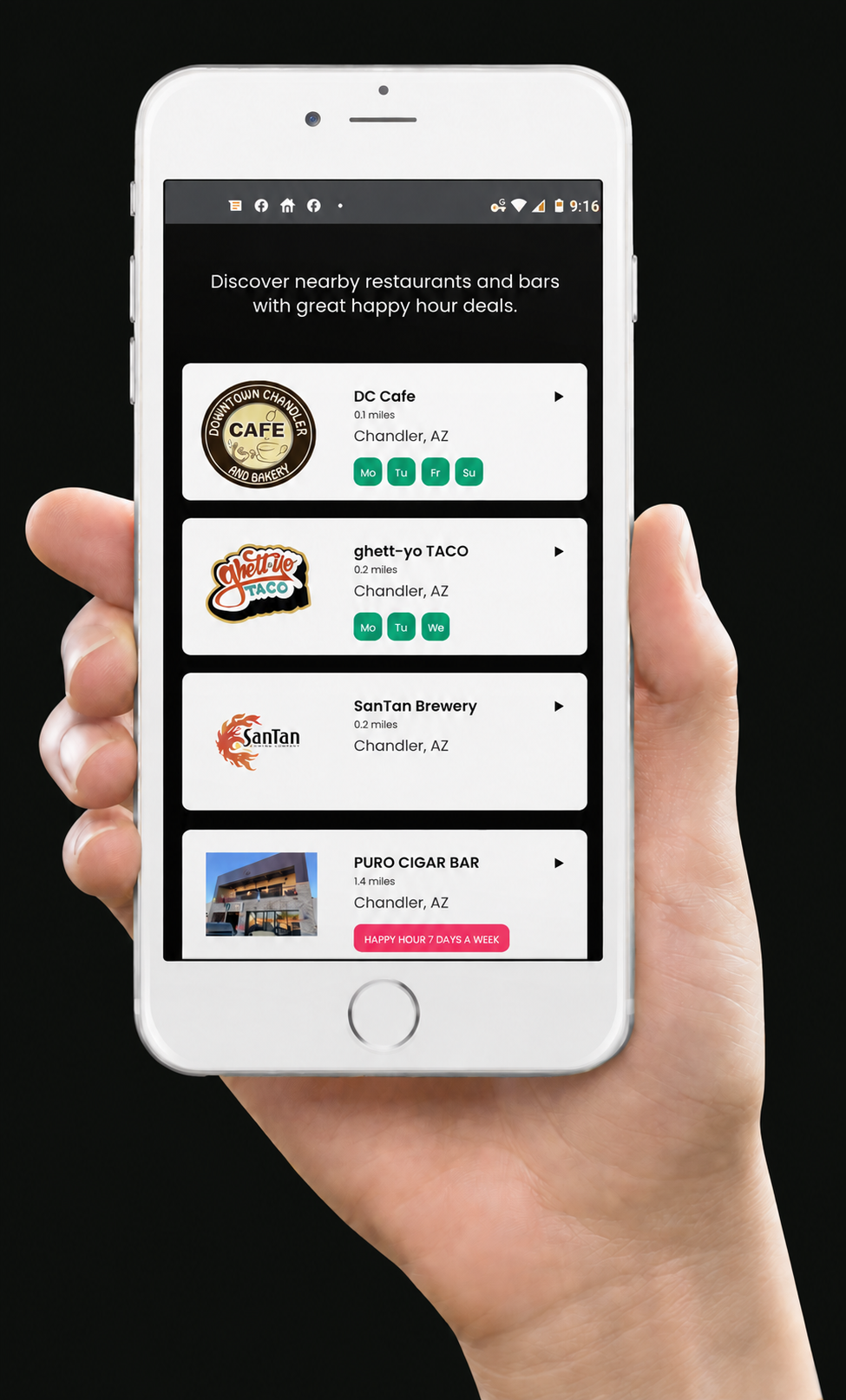 A hand holding a phone displaying restaurant listings